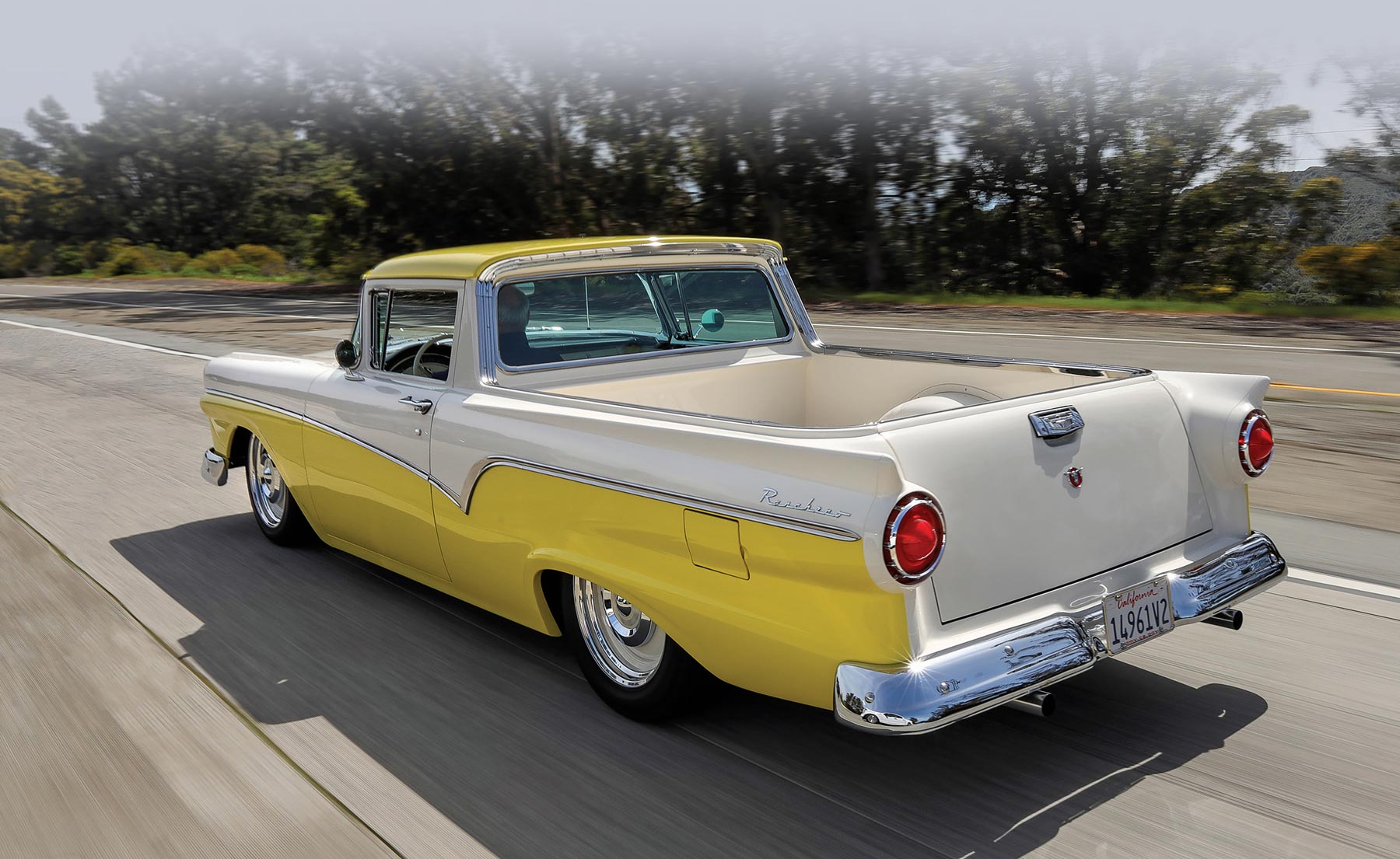 rear drivers side of a yellow and white '57 Ford Ranchero