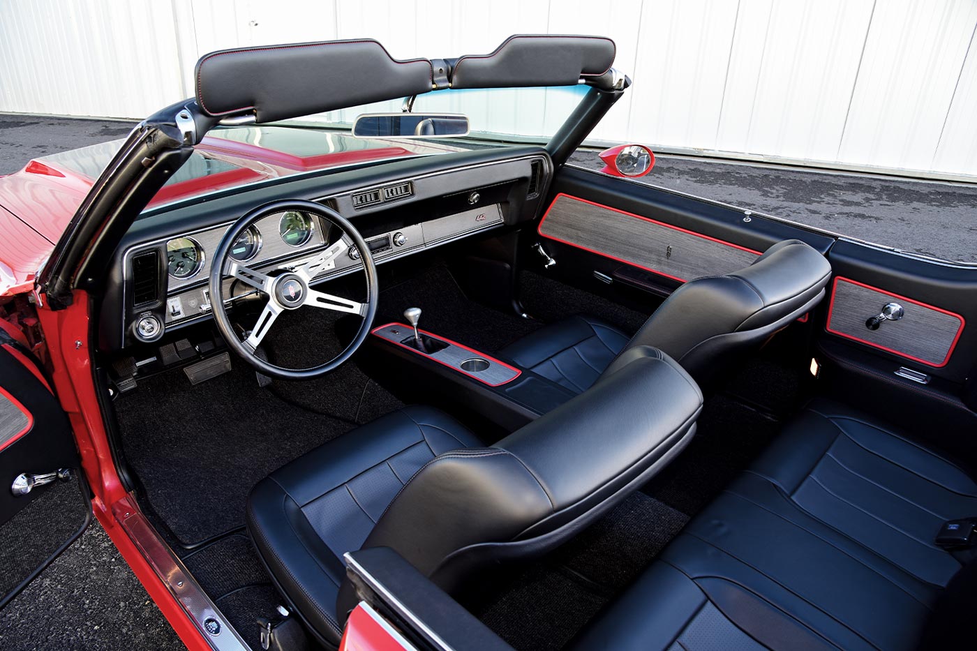 focused view, with the top down, on the ’70 Olds 4-4-2 convertible front seating and dash 