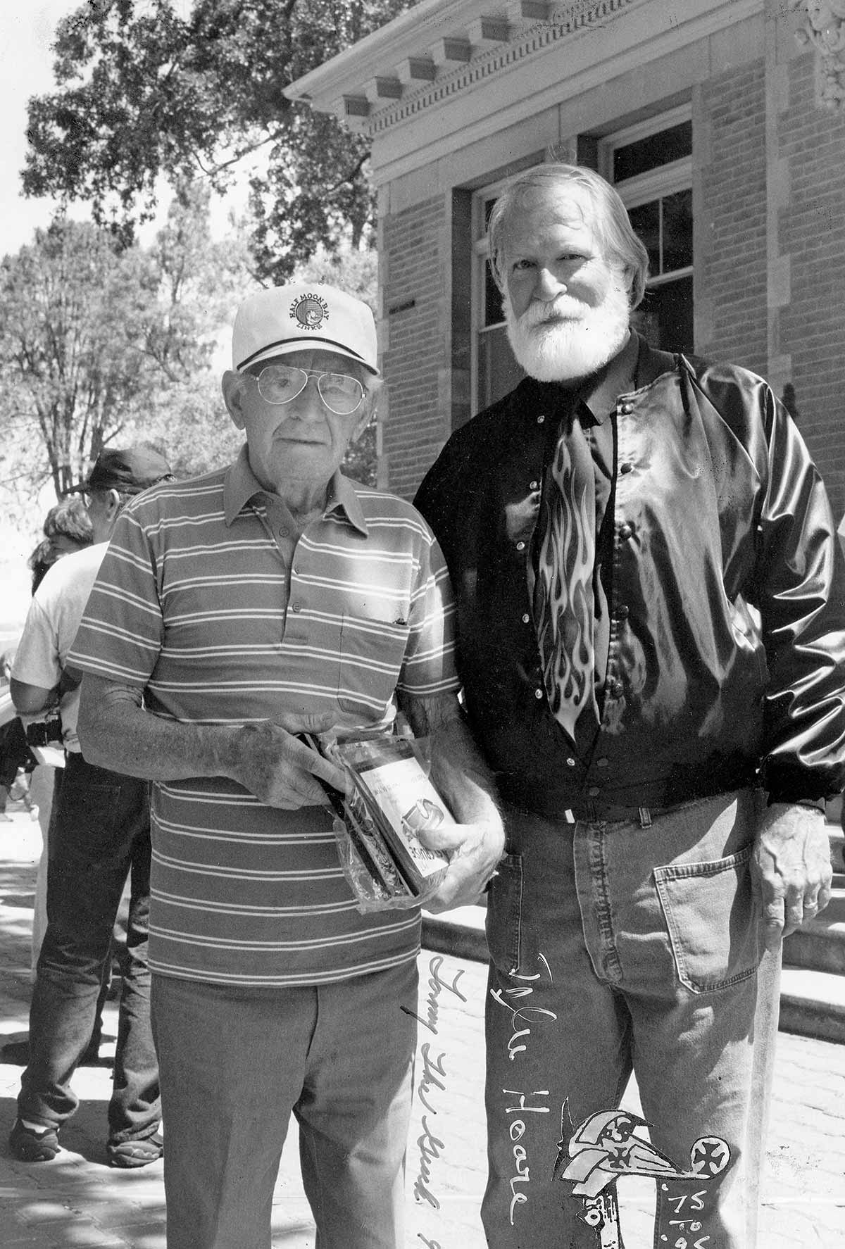 Black & white photograph of sculptor and custom car enthusiast Tyler Hoare meeting Tommy in the mid ’70s and later made sure he attended the West Coast Kustoms events in Paso Robles, where, in 1998, Tommy was inducted into the event’s Hall of Fame. Hoare also helped stage the annual Tommy The Greek lunch at now-gone Pier 29 on the Oakland Estuary. Hoare, of Berkeley, is celebrated for his Snoopy/Red Baron sculptures in the tidal flats of East Bay shoreline, among other public artworks.