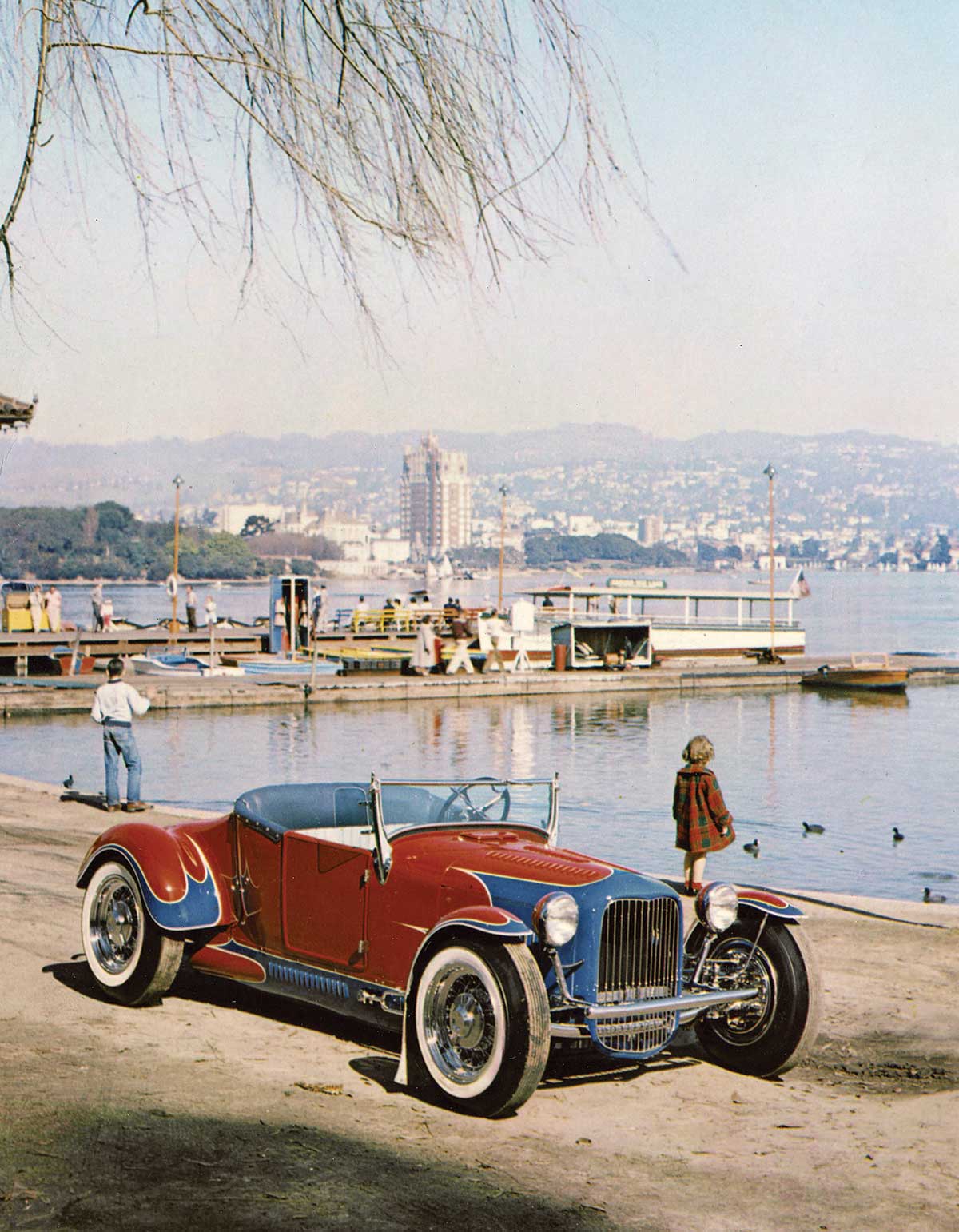 Vintage photograph of Frank Rose’s ’27 T bore one of Tommy’s more flamboyant scallop treatments when it won the 1954 America’s Most Beautiful Roadster award at Oakland. Shown here that year at Oakland’s Lake Merritt, the car featured a tubular frame and fender and hood metalwork by master shaper Jack Hageman Sr., a longtime Tommy The Greek collaborator.