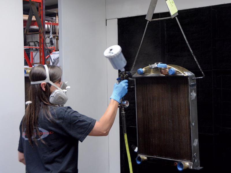 After the tanks and mounting brackets are installed, the radiator is placed on an assembly line that leads to the painting station. Brittany handles painting duties and final assembly.