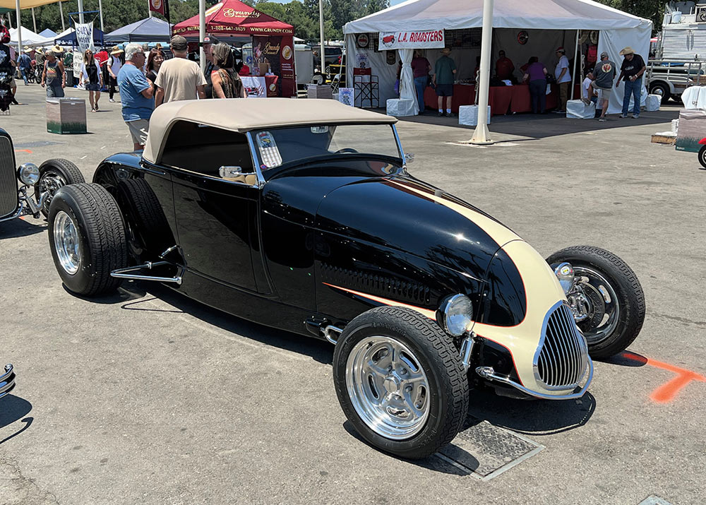 Black track-nosed '29 Ford with cream scallops on hood and engine bay's side panels