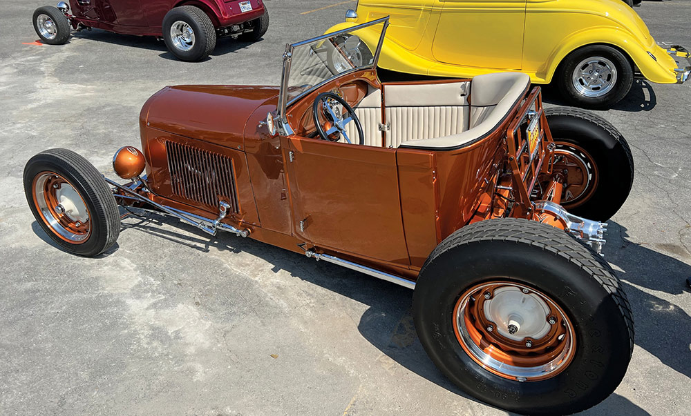 Bright copper orange '28 Ford with bed delete and quick change