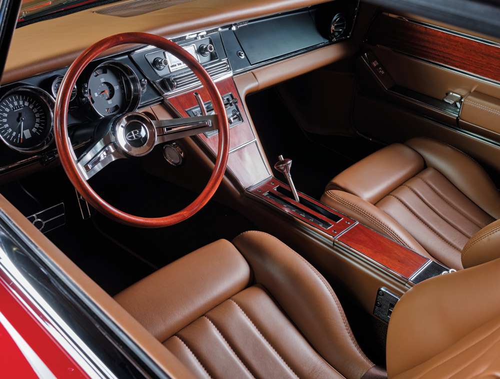 dashboard, steering wheel, and brown leather interior inside of a ’65 Buick Riviera GS