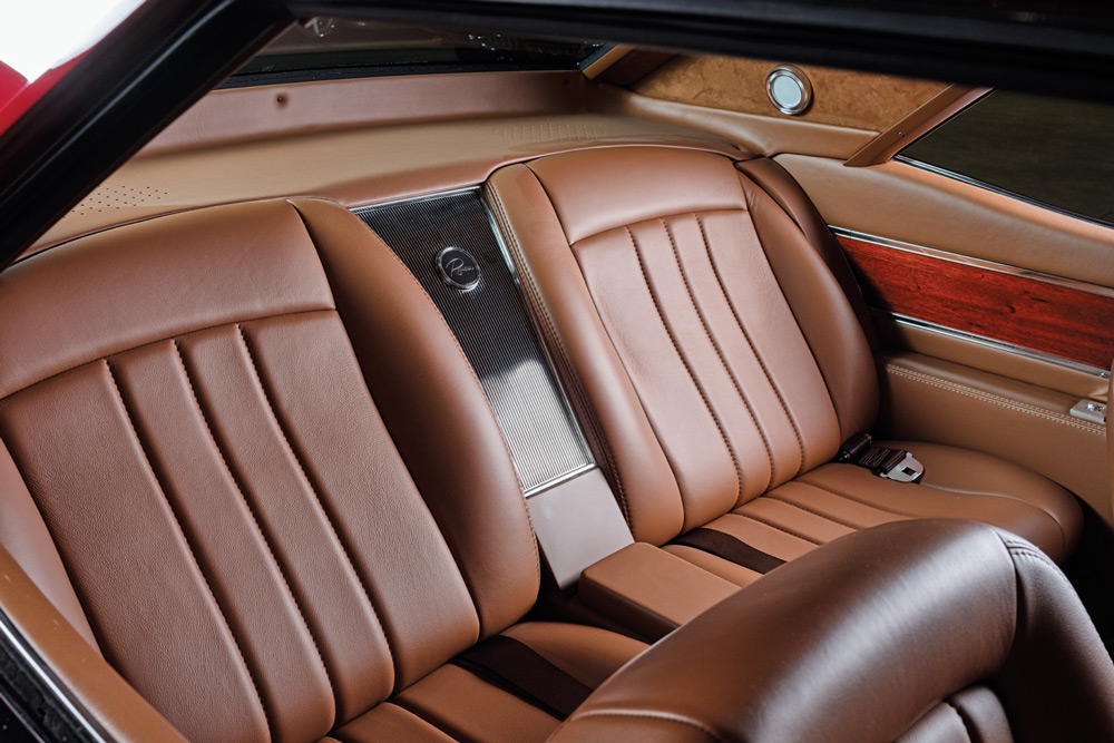 brown leather interior in the backseat of a ’65 Buick Riviera GS