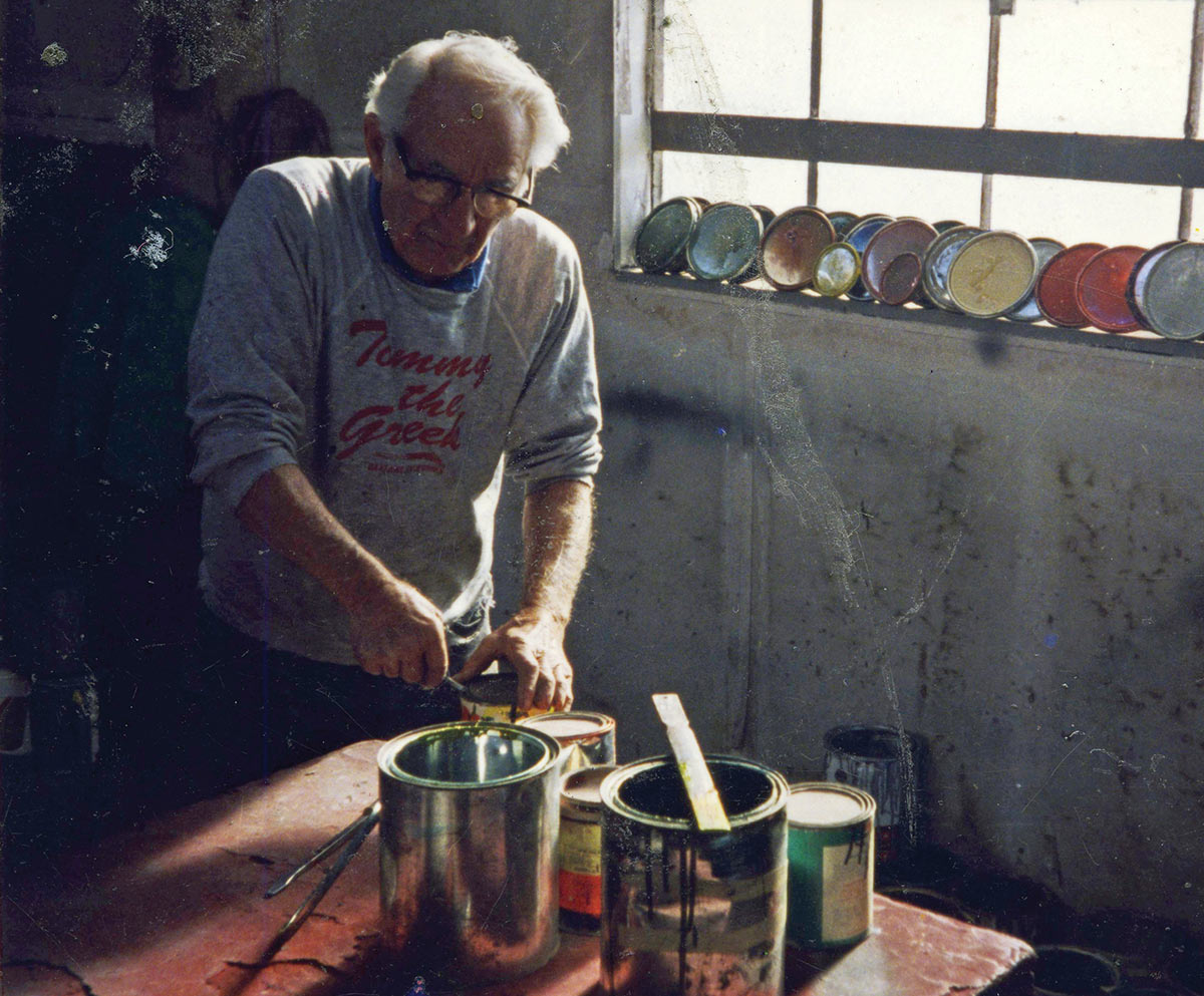 Tommy in his shop in 1994 mixing paints