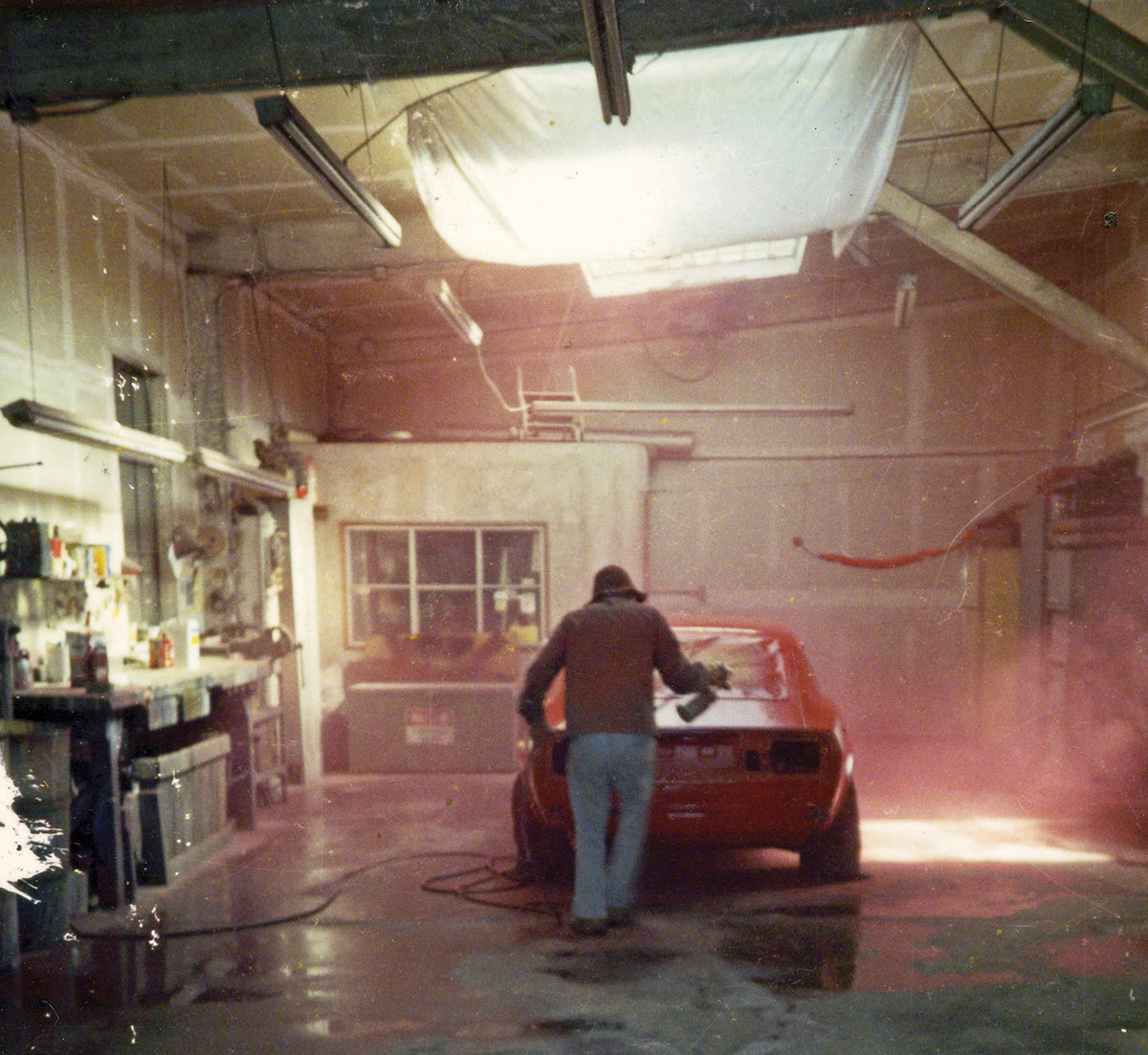 Tommy painting his last car bright red in 1994