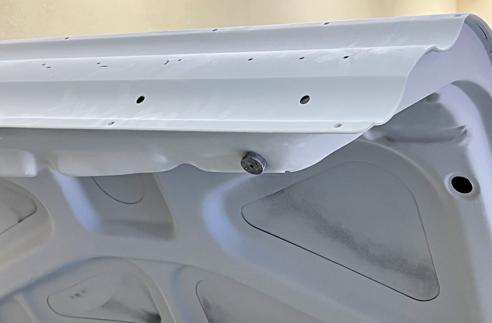 Begin by fitting body panels with the corresponding bumpers, snubbers, and, if necessary, even seals. This ensures that the panels orient the way they will on the finished car.