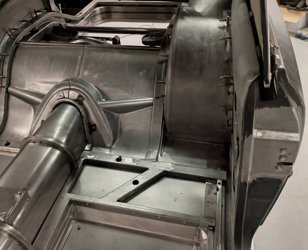 The floorpans get a little more complicated toward the back of the car, and DSR fabricates smooth steel pans to cover the three-link crossmember.