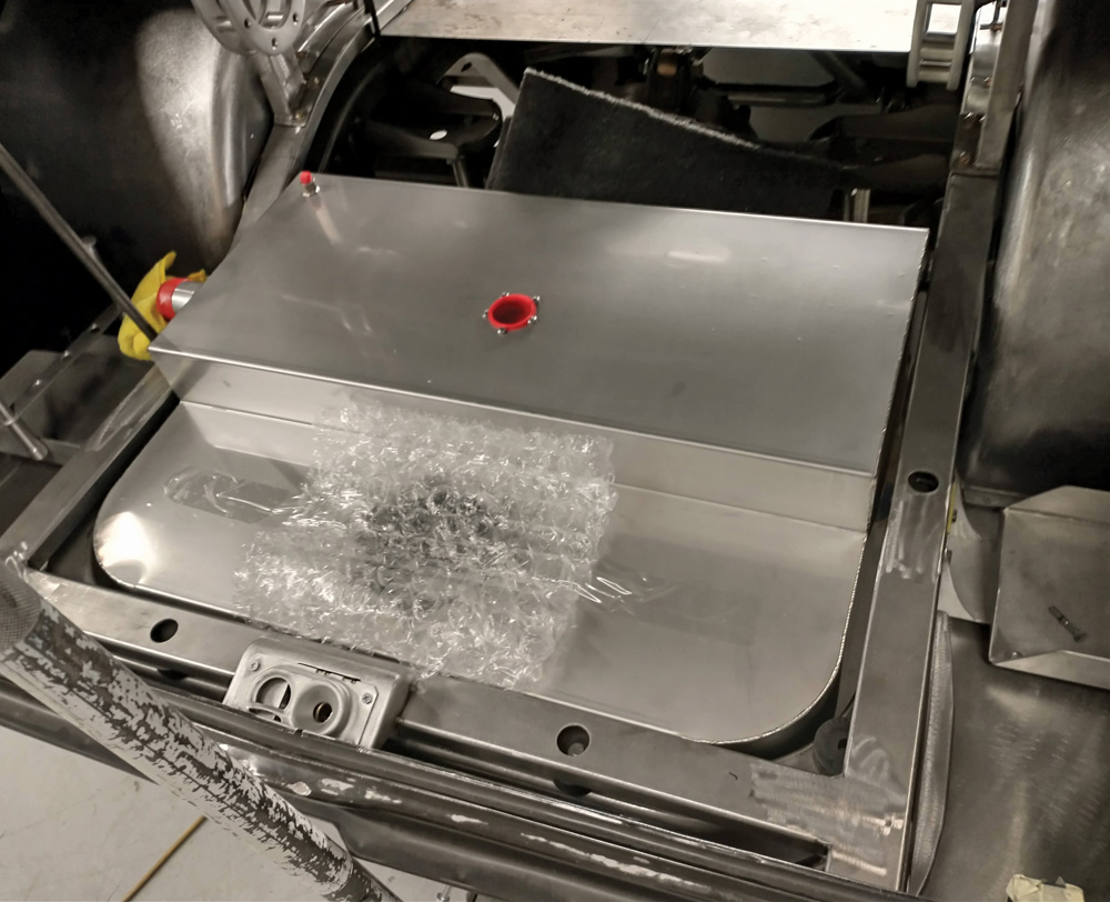 A custom stainless steel fuel tank from Rock Valley Antique Auto Parts takes up most of the trunk pan area and fits nicely within the framerails. Custom filler panels tie the trunk area together with the wheeltubs.