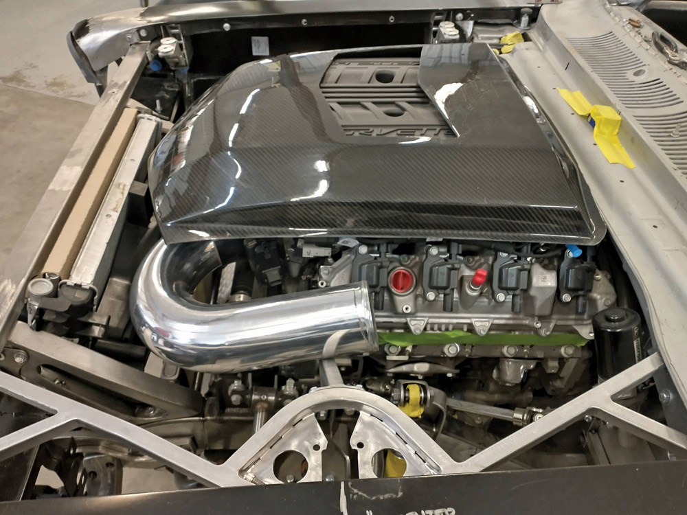 The engine bay is starting to get crowded, as more components are mocked up. DSR fabricates a custom cold-air intake pipe and fits the carbon-fiber intake cover.