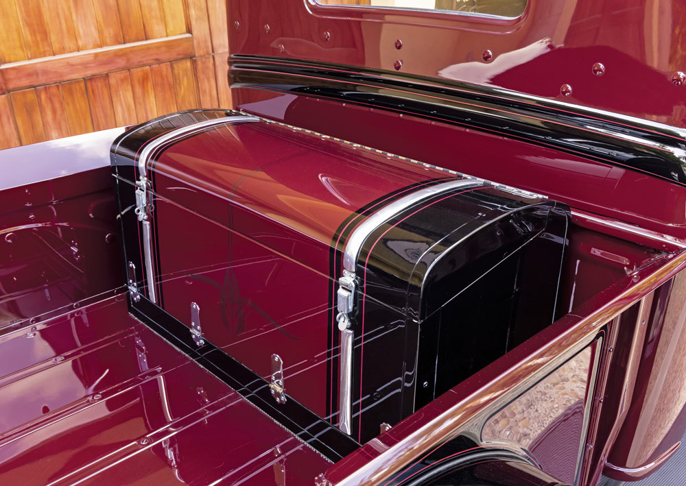 built in chest in the back of a red ’32 Ford