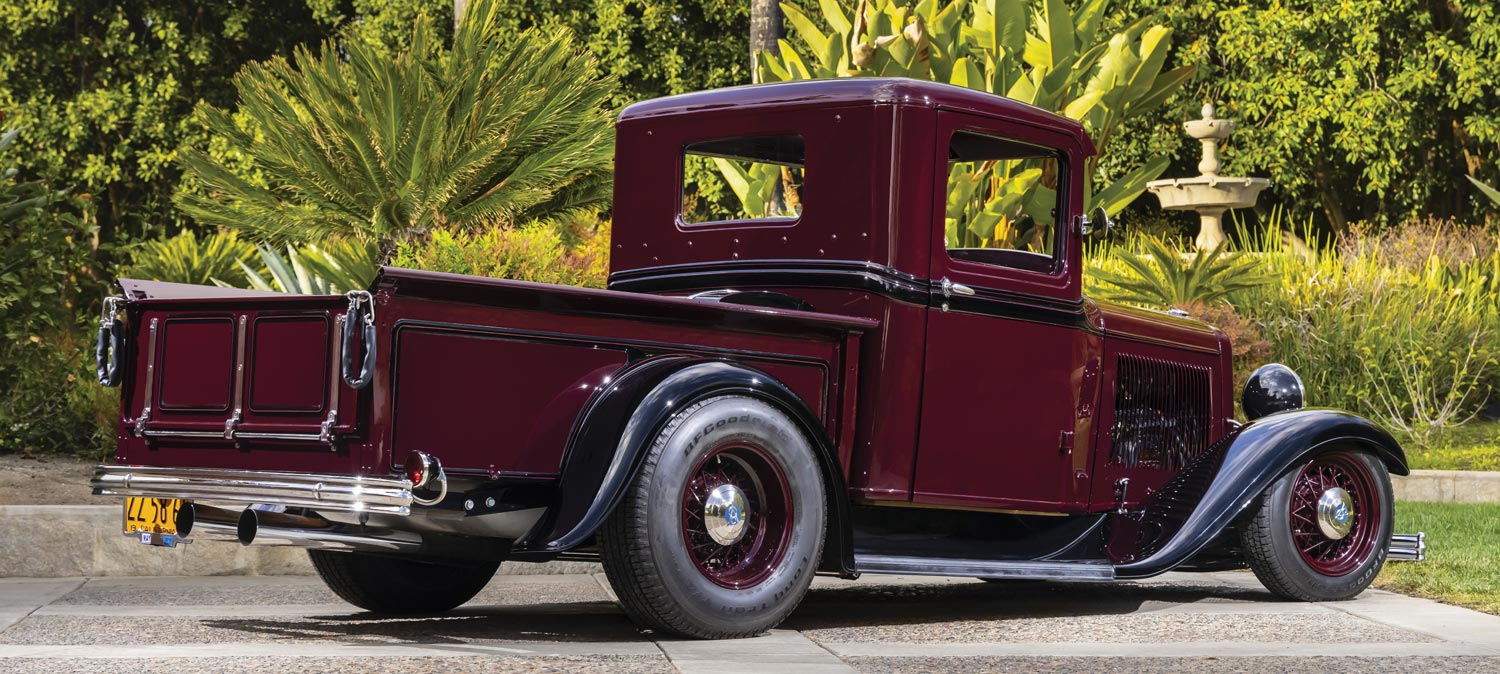 rear passenger side of a red ’32 Ford