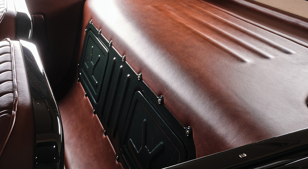 brown leather in the back of a green ’30 Ford