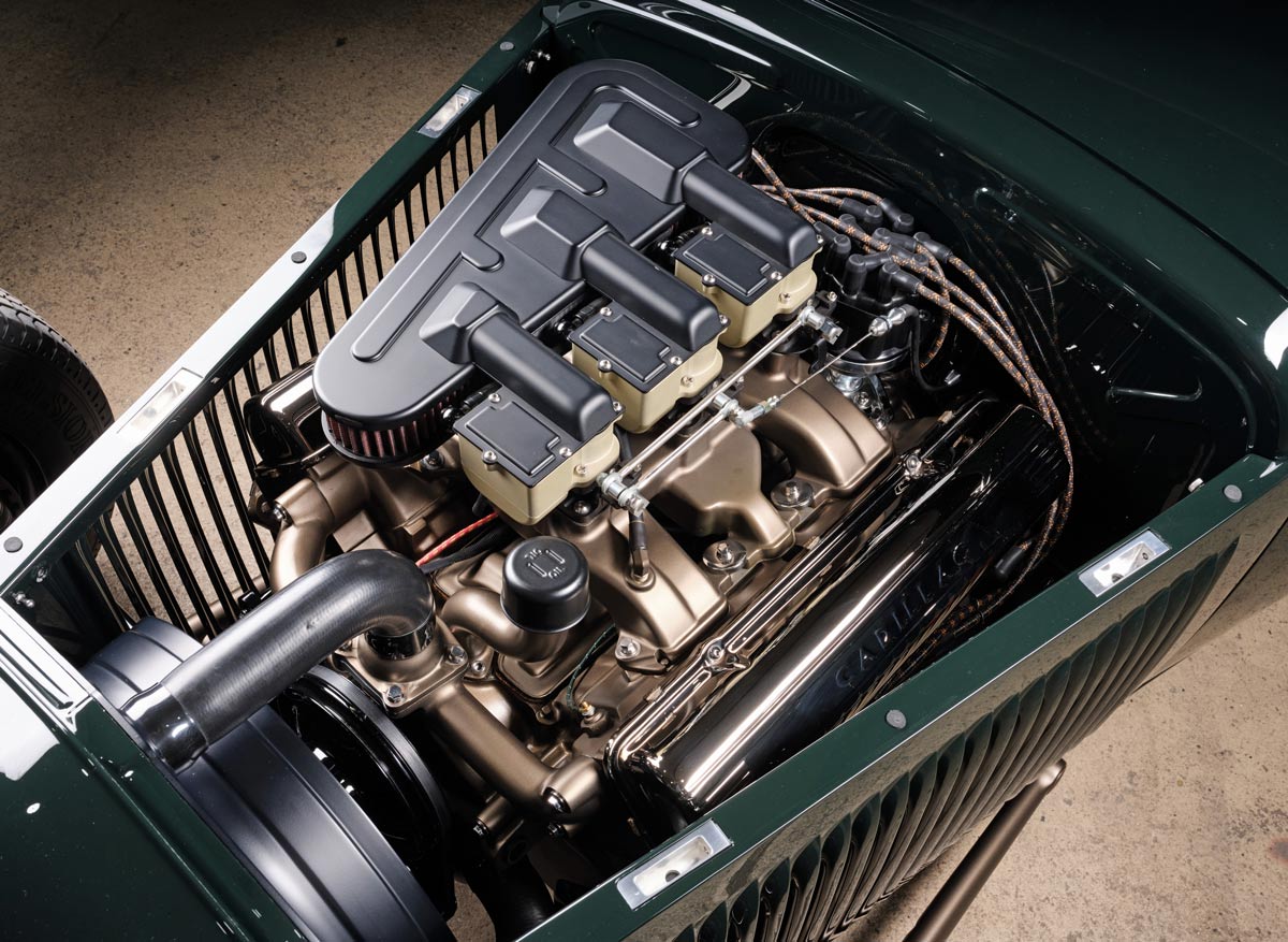 close up of the engine in a green ’30 Ford