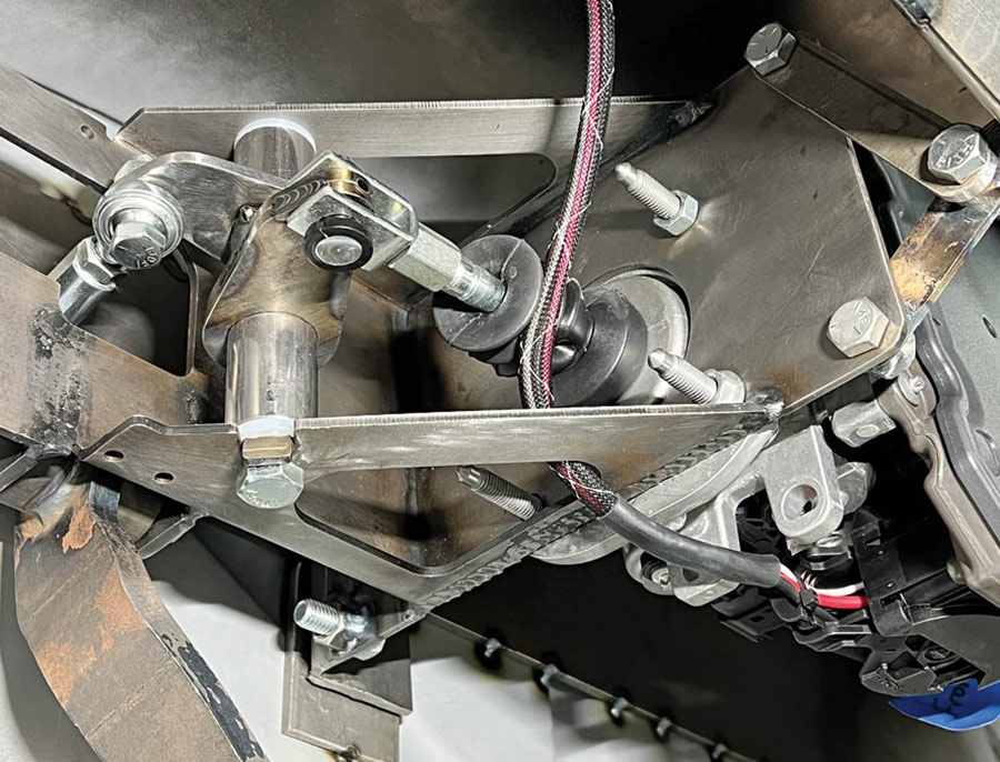 Here a pedal assembly with an electric booster is in place. Standard-length brake pedals are used, the difference in pedal ratio is made up at the bellcrank.
