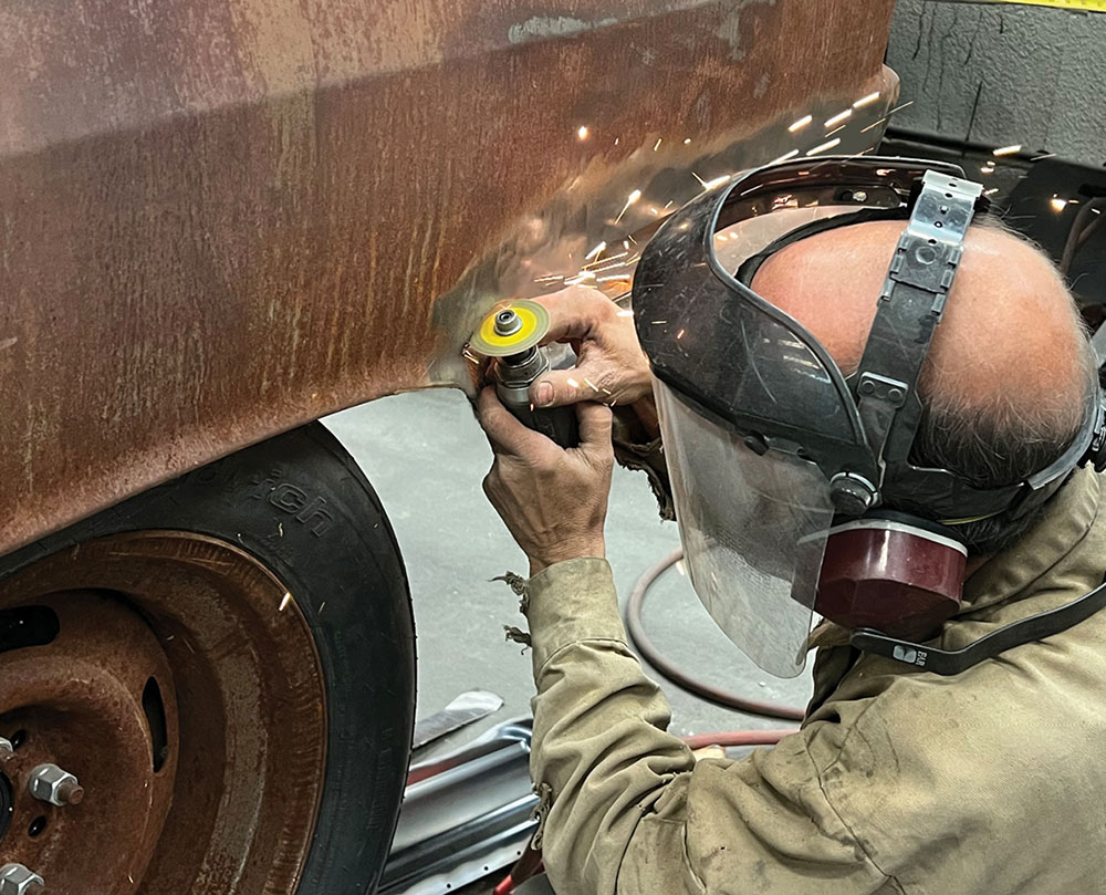Jones cutting away rusty rear quarter panel
