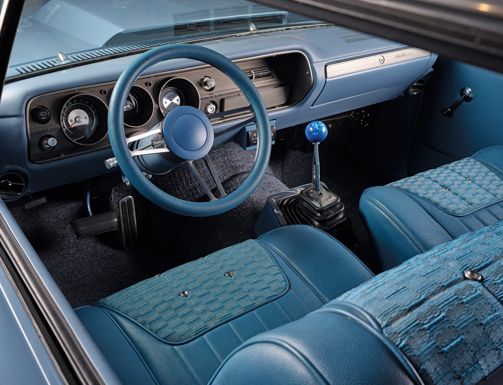 blue interior, steering, dashboard, and shifter in a ’65 Chevelle