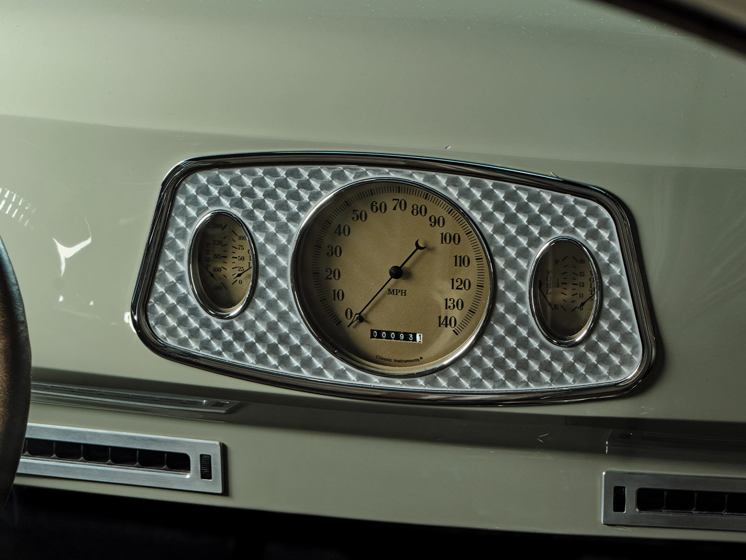 close view of ’33 Ford gauges from Classic Instruments on the dashboard of the desert beige ’41 Willys Coupe