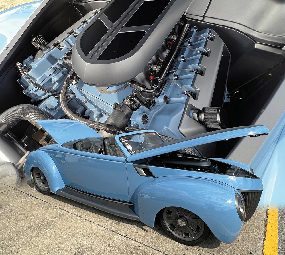 Customized sky blue '39 Ford roadster with its color matching Coyote V8