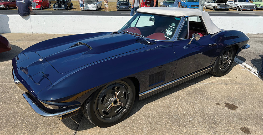 Navy '67 Corvette convertible with white top