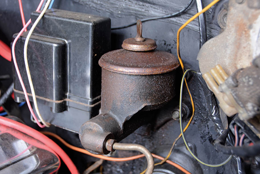 Age makes this ’63 Impala’s original singe-pot master cylinder a real hazard. A simple leak in the hard lines, flex hoses, or wheel cylinders will evacuate all the fluid and leave you in a bad situation.