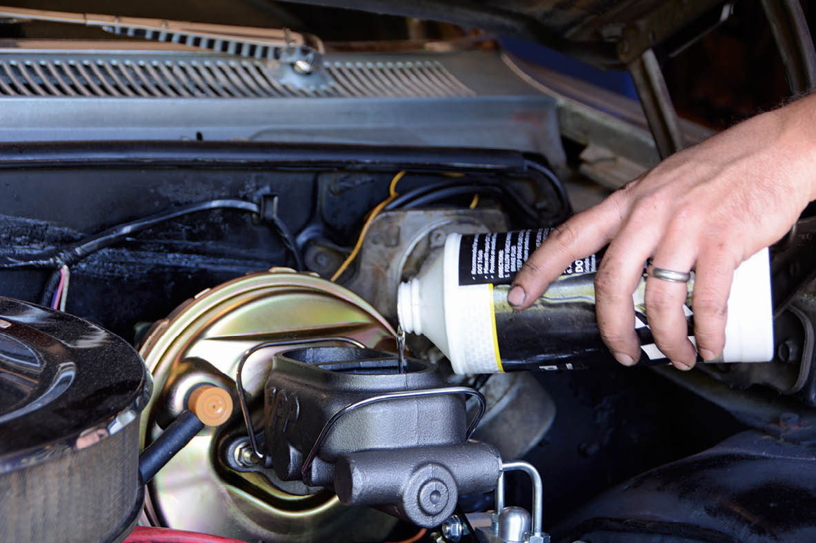 We topped off the fluid, using DOT 3 brake fluid. The lid can be fastened, but we’ll have to top it off one more time after bleeding the system.