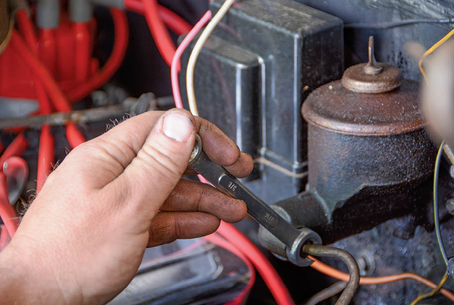 The original single line is removed from the master cylinder as well as the distribution block on the frame. It can be discarded.