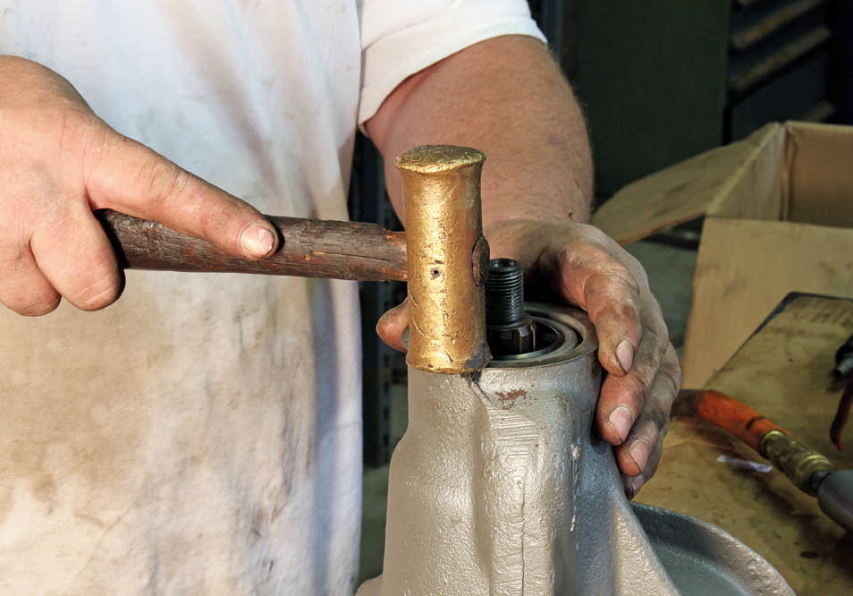 The pinion oil seal comes next, and it is properly installed when the flange is seated against the face of the case. No liquid sealer is required. It simply taps in place. 