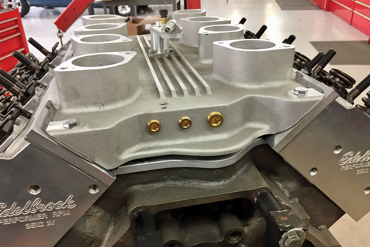 Close up showing an air gap between the intake manifold and the valley cover