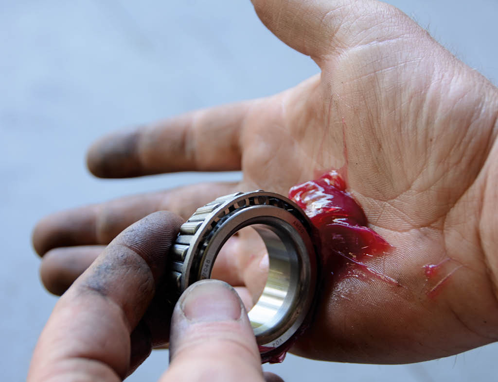 We pack the wheel bearings using the tried-and-true palm method, ensuring smooth operation for many years of driving.