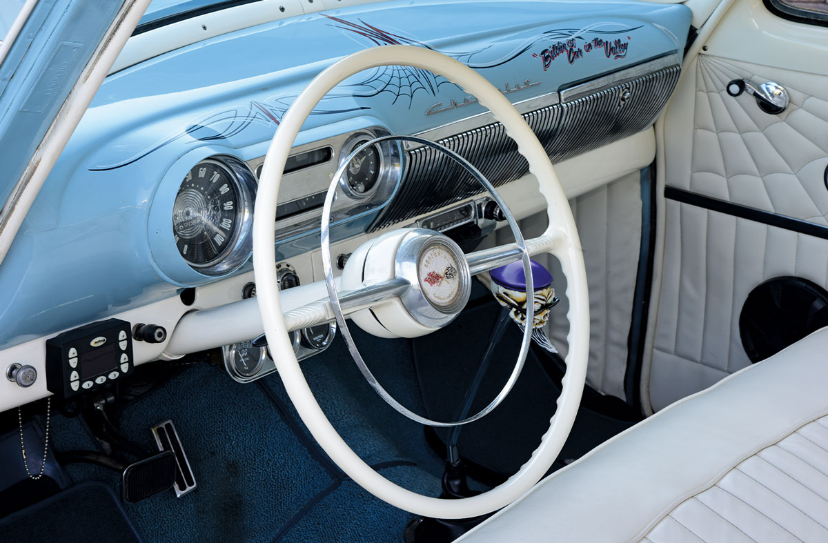 driver side interior view of the Chevy 210's steering and dashboard