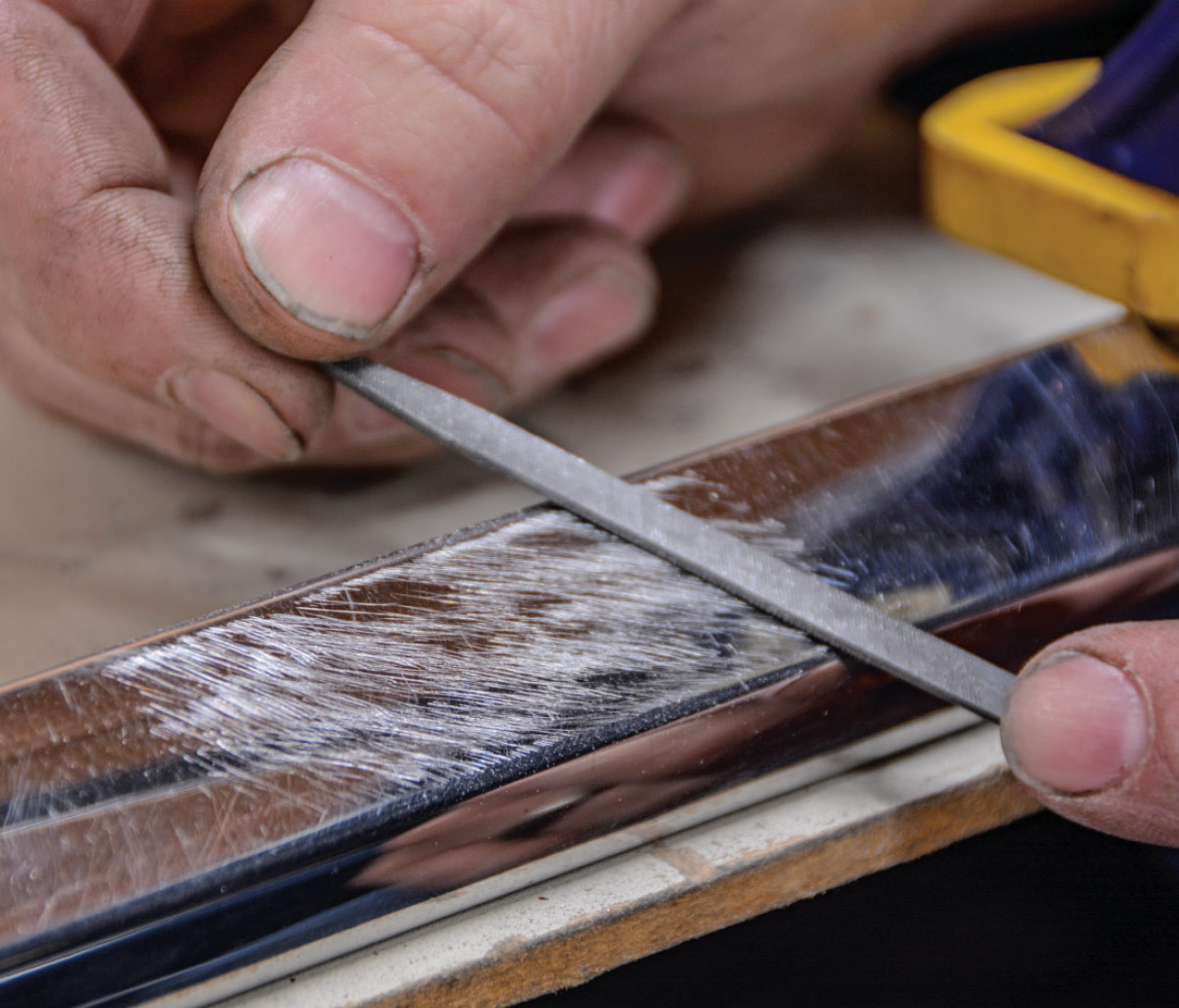 close view of the small file being used on the trim piece