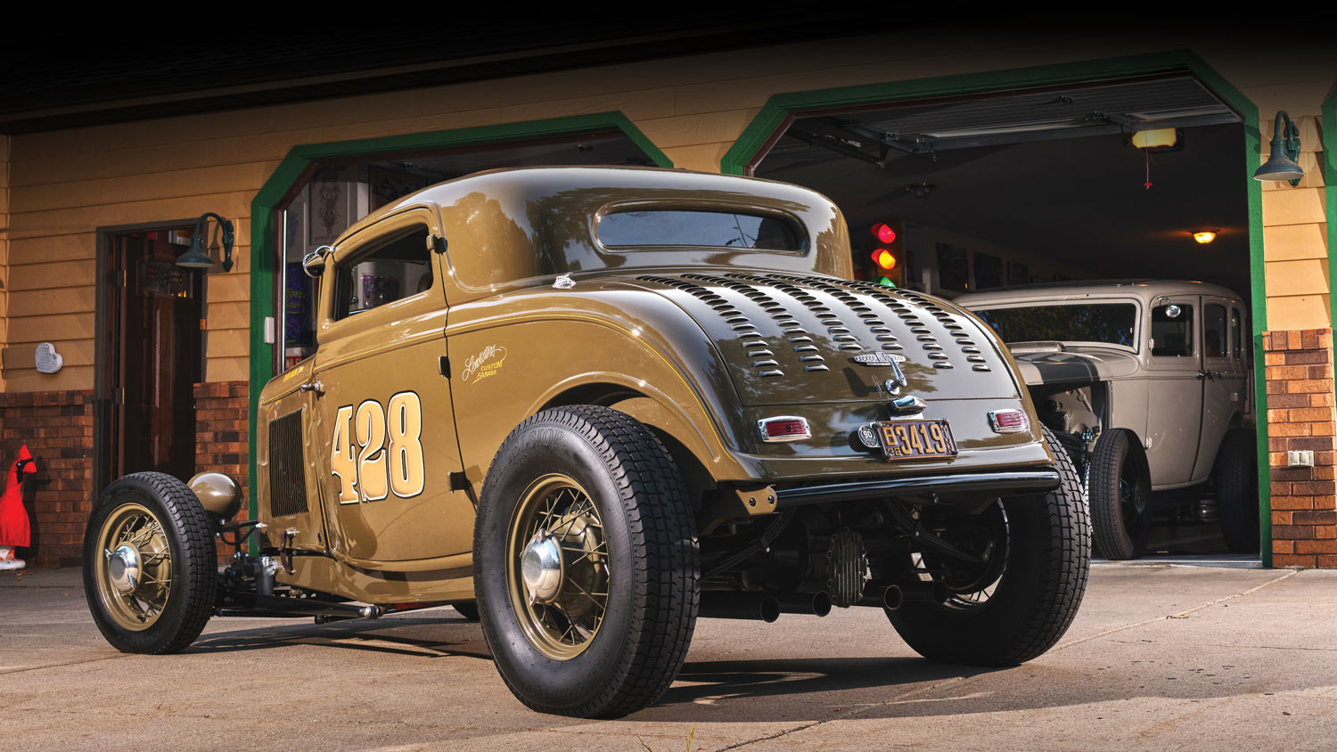 rear of a brown ’32 Ford with the number 428 on the side