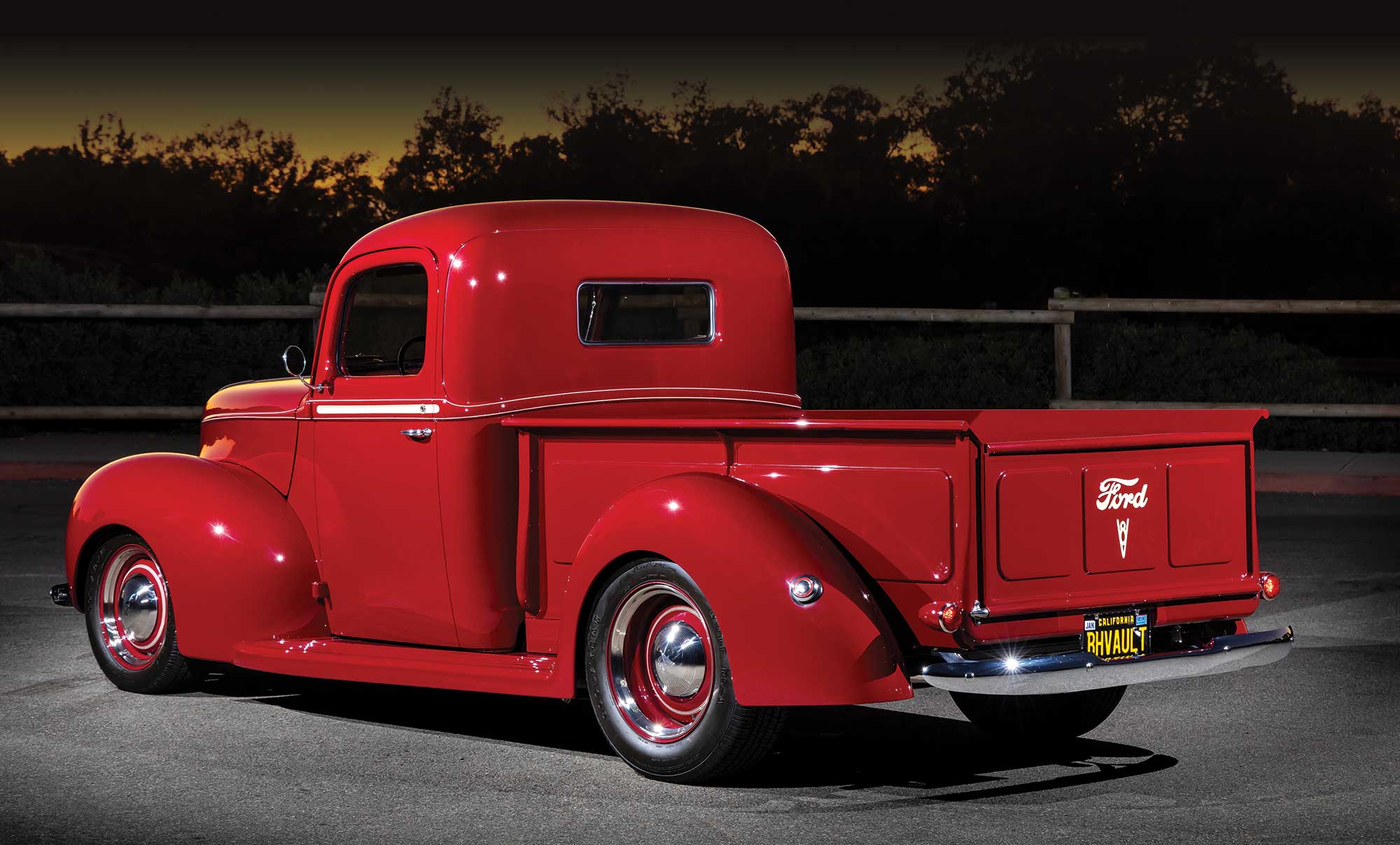 3/4 rear view of red '40 Ford Pickup truck