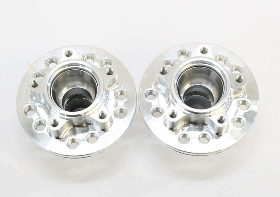 Viewed from the back, the small five-hole pattern is where the rotor attaches. The five threaded holes in the outer diameter of the hub are for the lug bolts.
