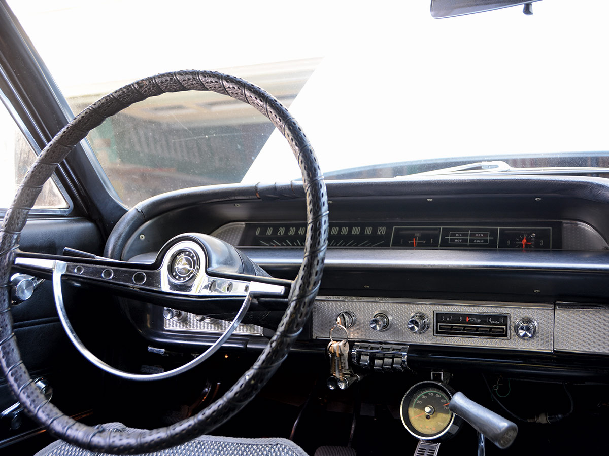 steering wheel with silver stereo setup next to it