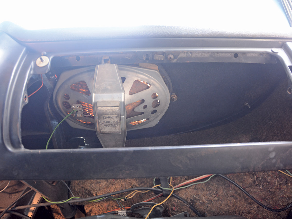 area between glovebox and dash with speaker removed