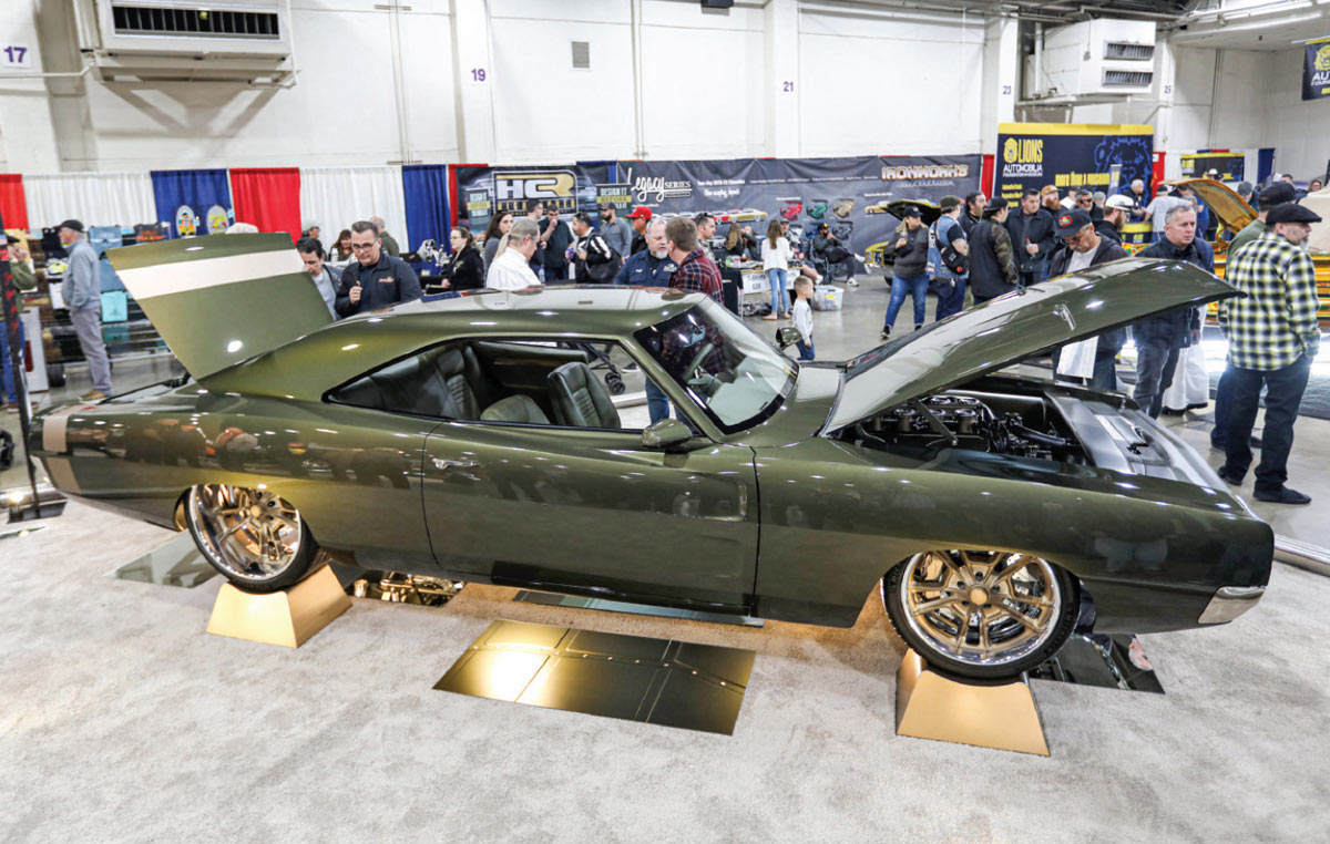 passenger side of a forest green ’68 Charger R/T with the rear gate and front hood open