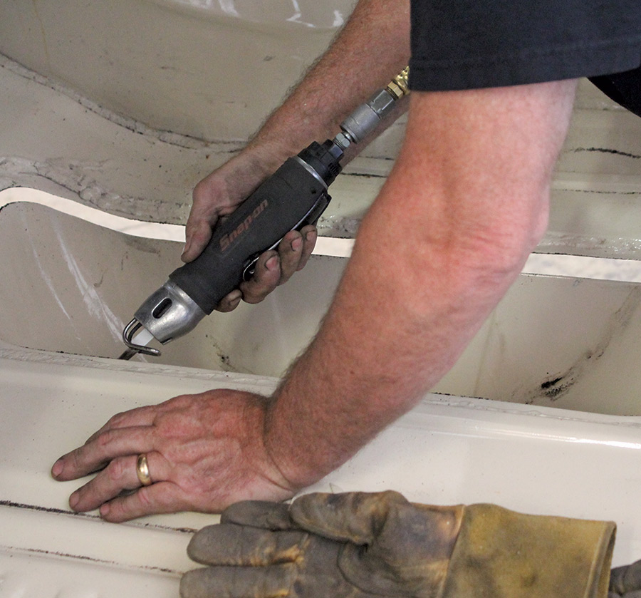 closeup of person removing the original stock floor