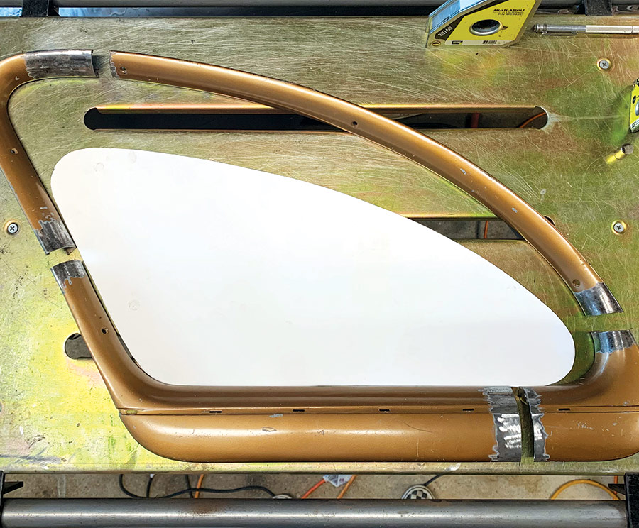 window frame lying on a metal work table