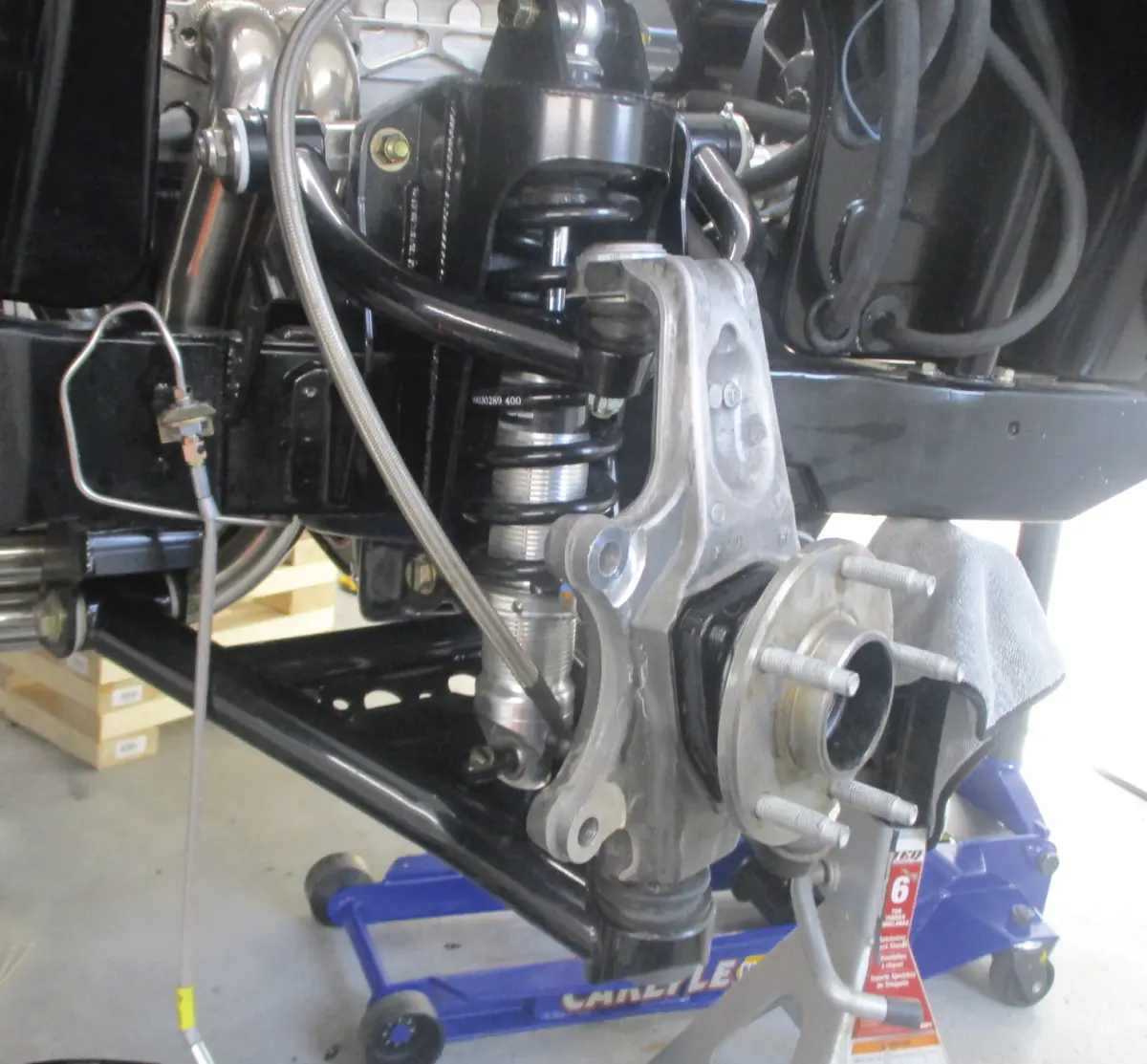 McLeod’s Nova with its original equipment, DSE’s front clip with coilovers and Corvette-style spindles and hubs