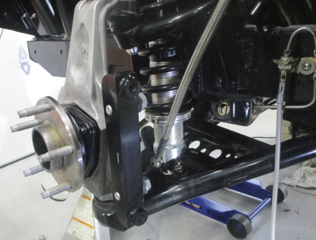 close view of a wheel hub including a view of the strut