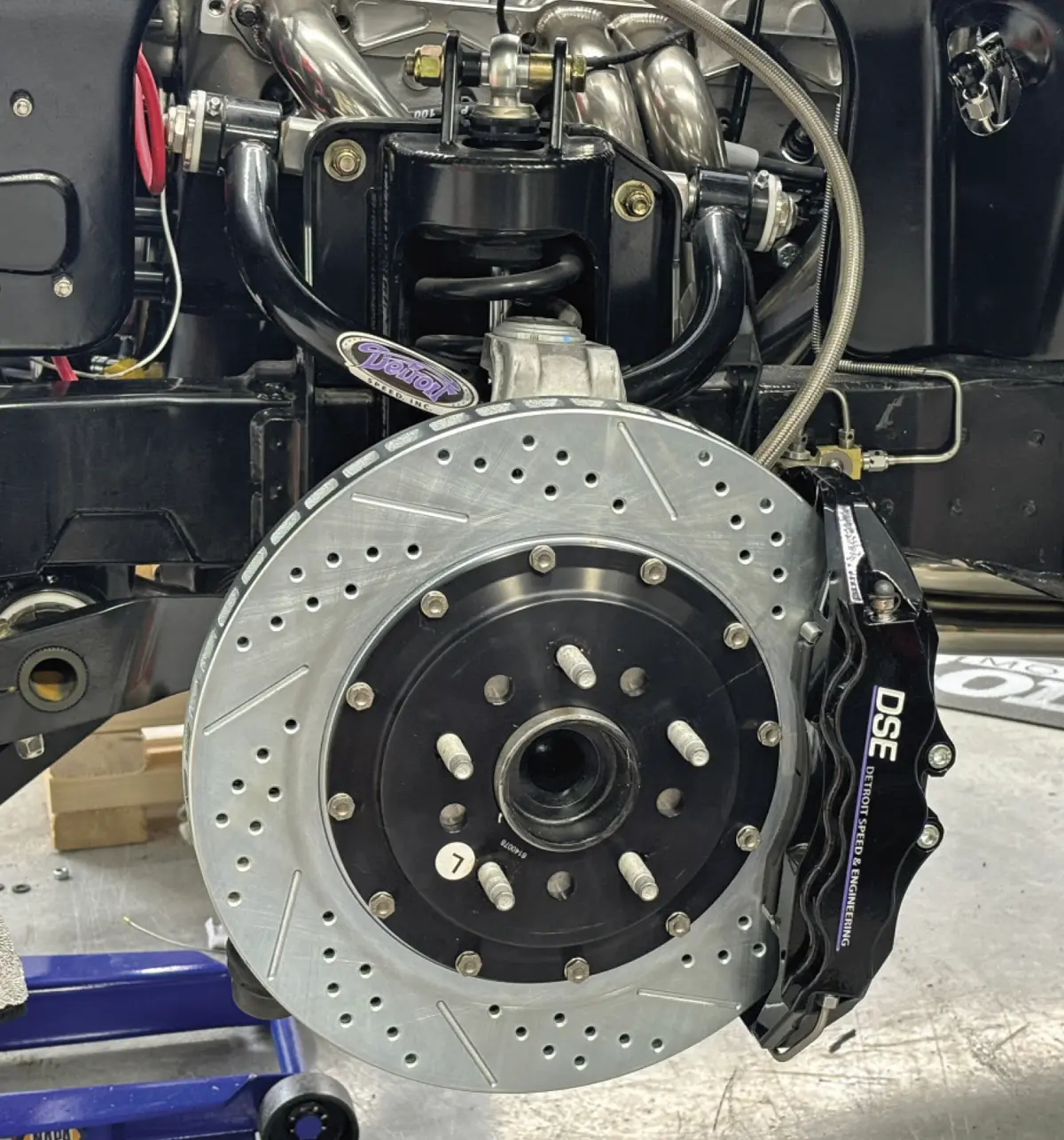 front view of a wheel hub and rotor with the front caliper and pad installed