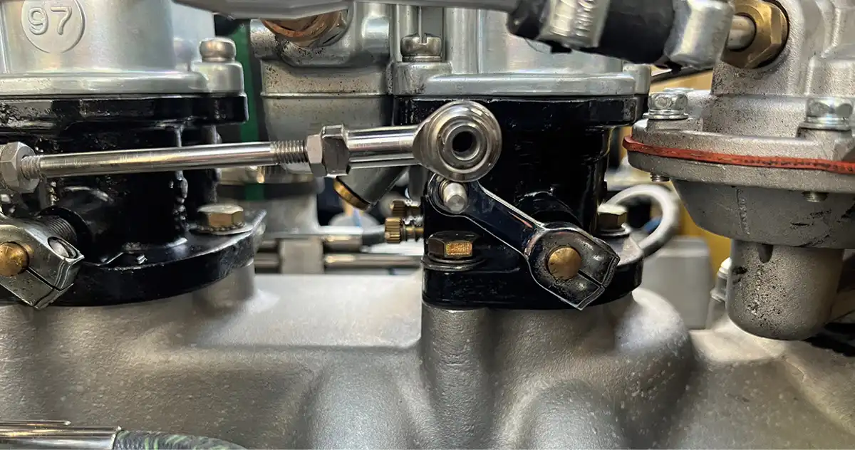 Now, we must adjust the linkage so it fits perfectly without moving either carburetor from its full resting place. We had to loosen and slightly shorten our linkage arm.