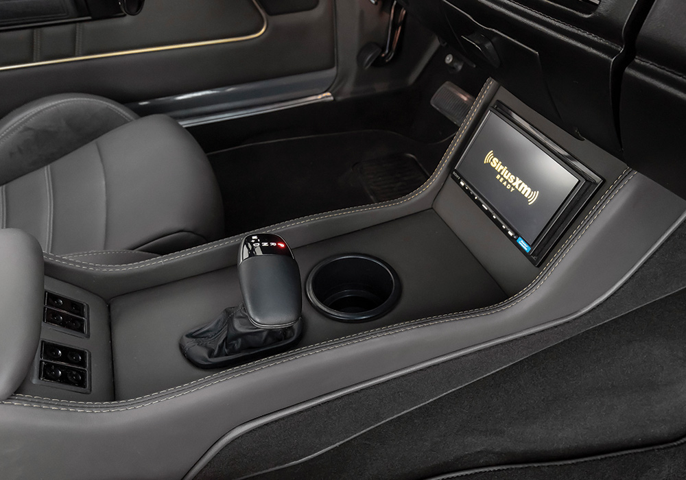 center console view with gearshift and navigation screen in grey 68' dodge charger 