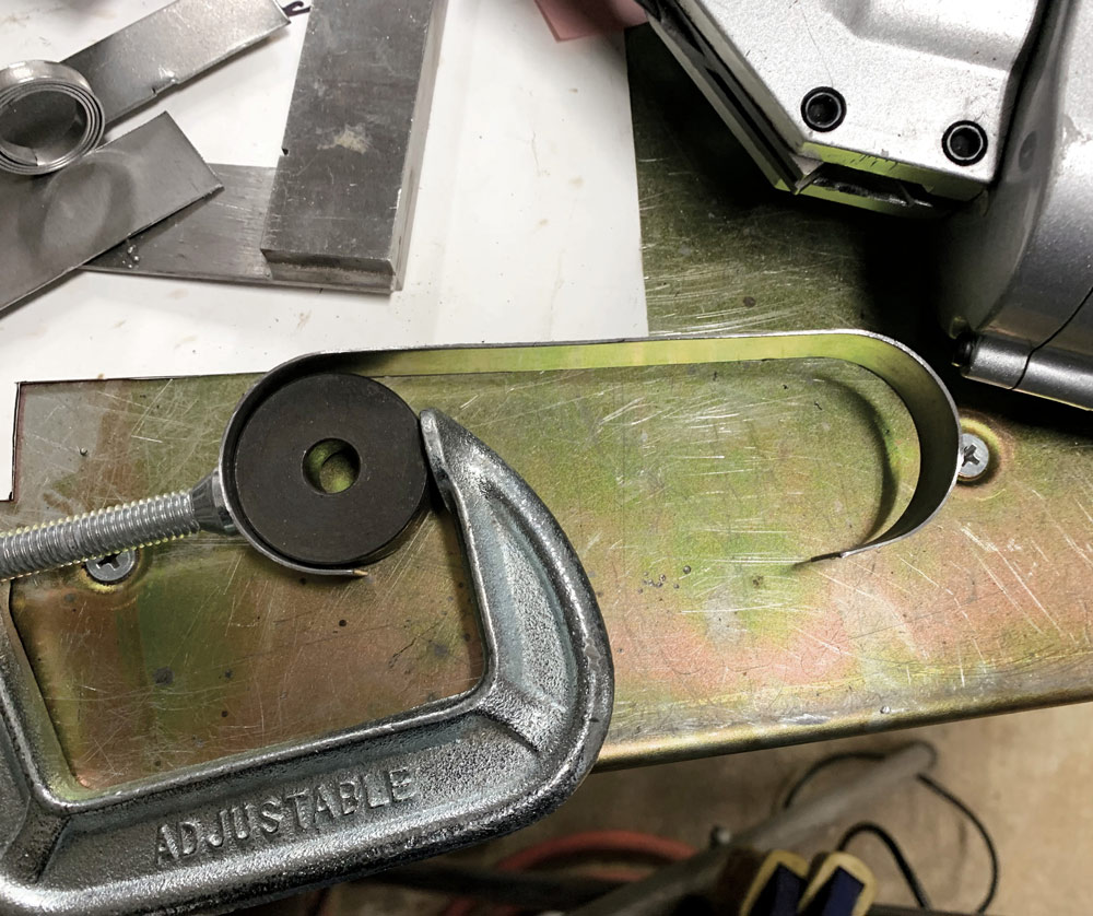 bending 2-inch-wide strip of steel