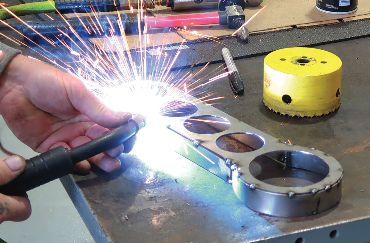 metal strip tack welded to panel