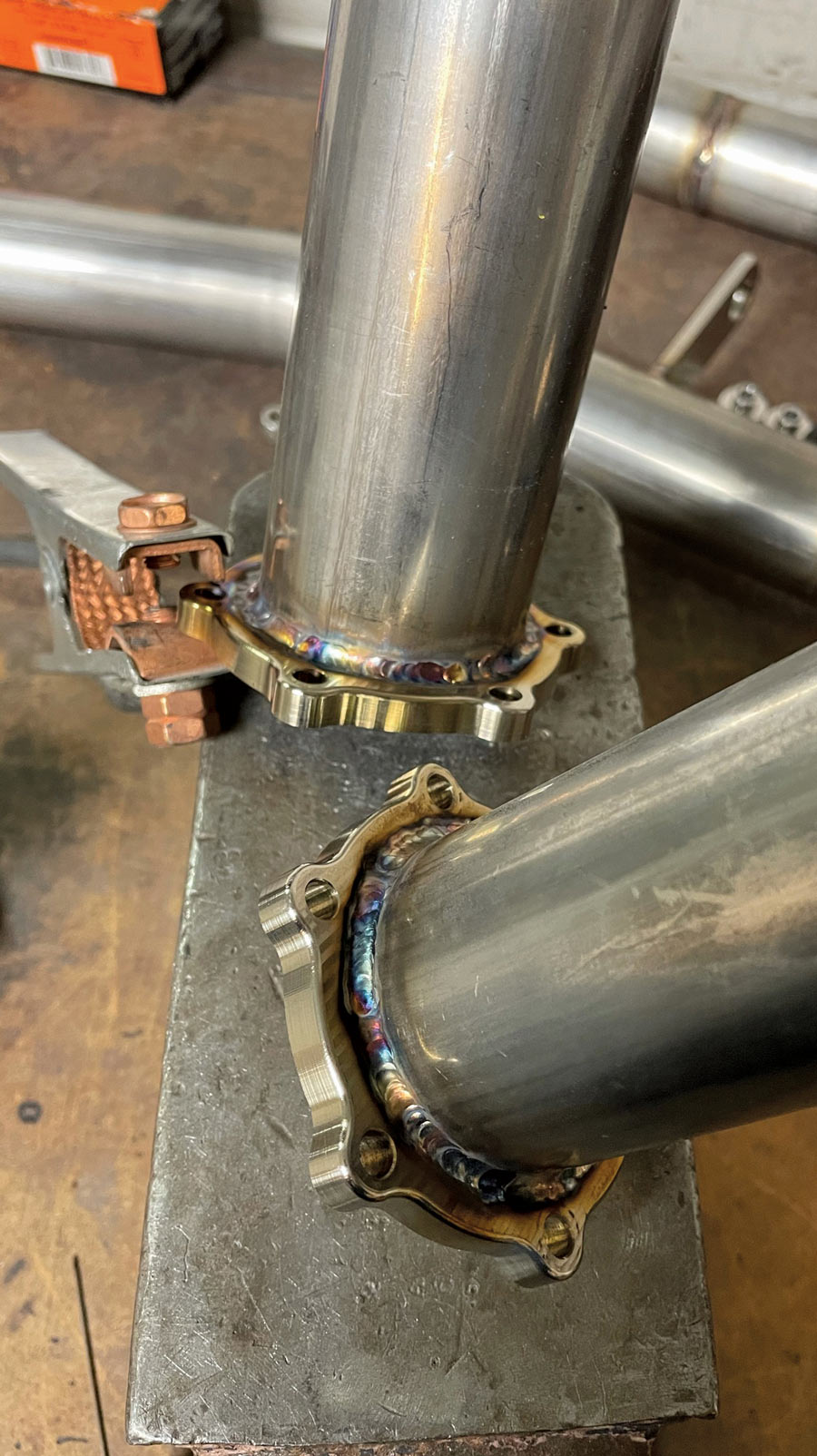 closeup of flanges joined to exhaust tube 
