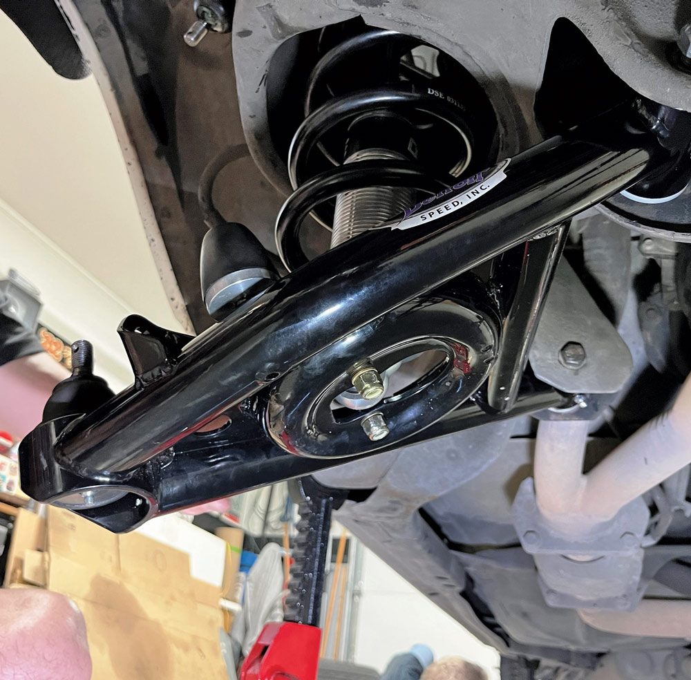 coilover assembly being installed